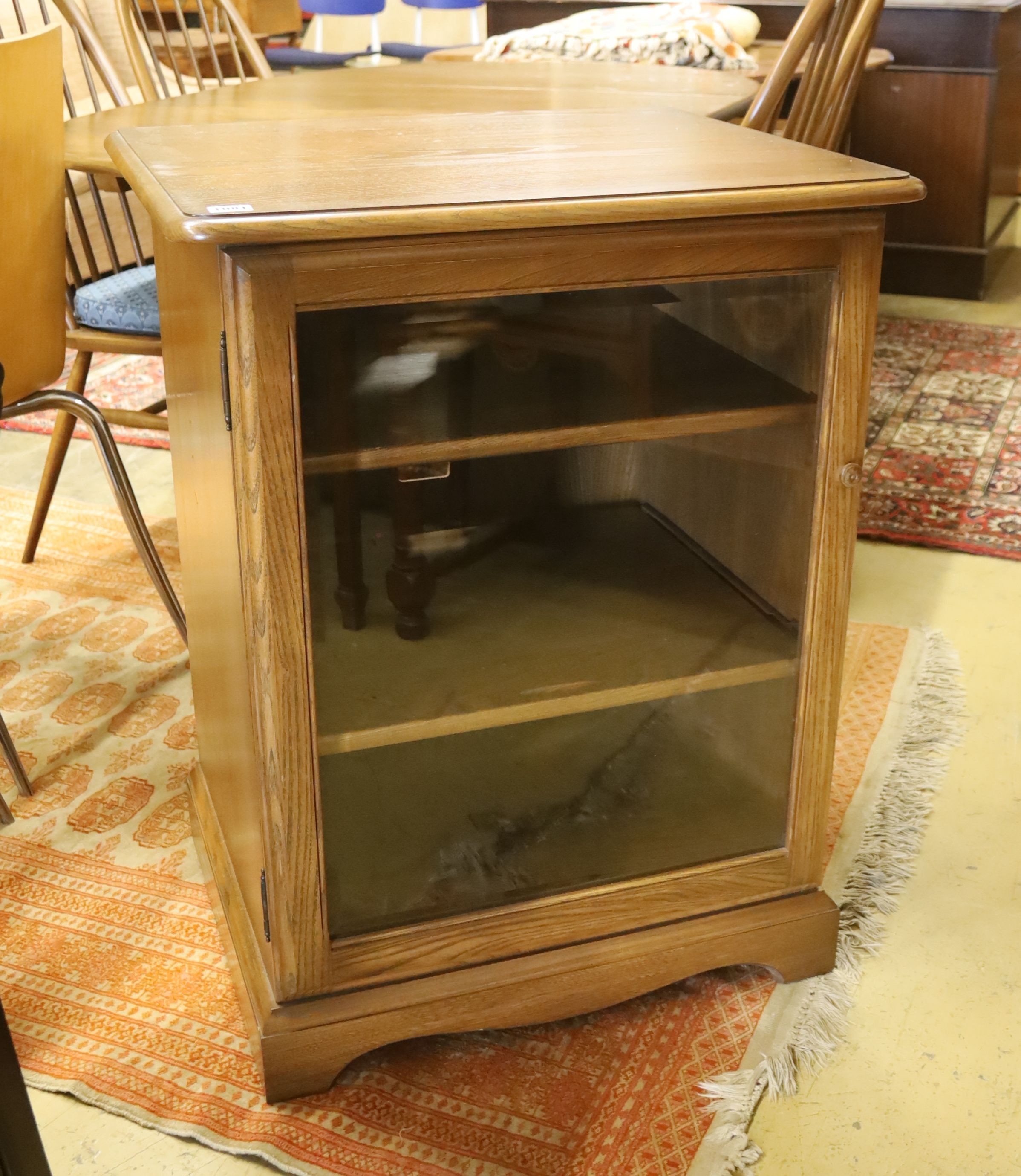 An Ercol glazed elm media cabinet, width 63cm, depth 53cm, height 82cm